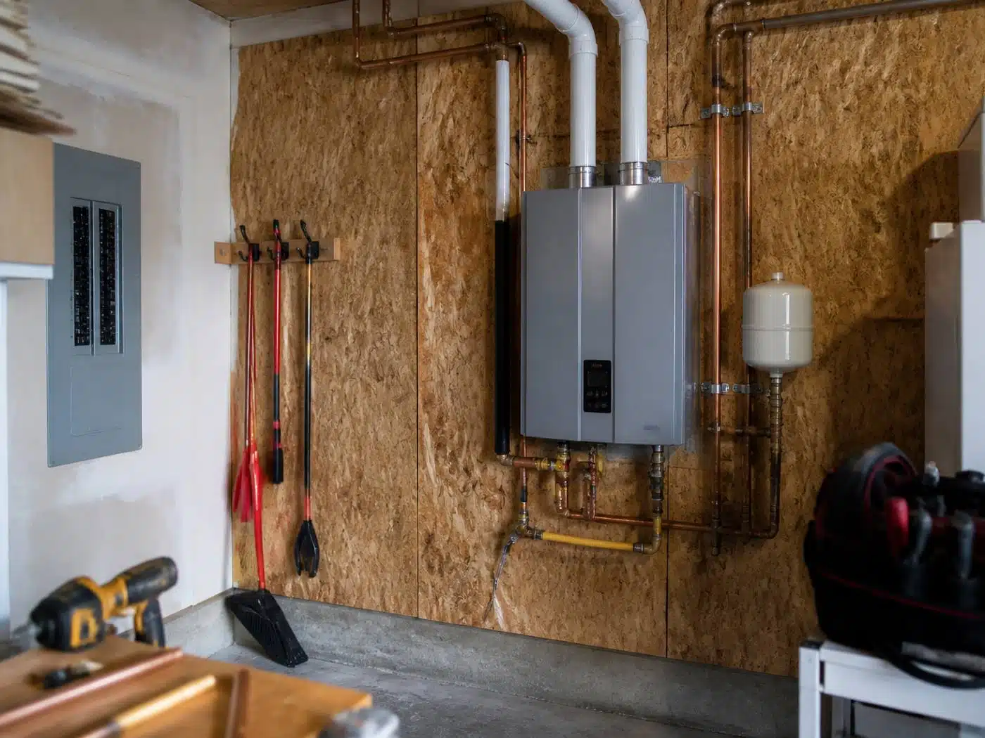 Wider view of the work area, tankless water heater conversion piped into a Denver home plumbing system